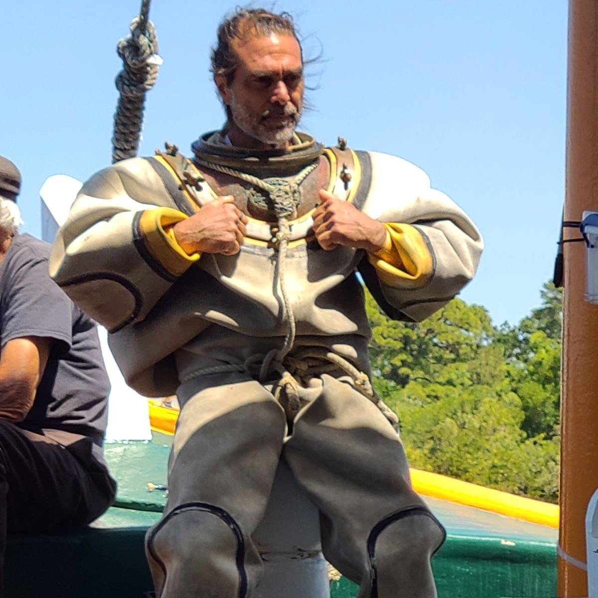 spong diver in full gear getting ready to dive for sponge in the ocean waters